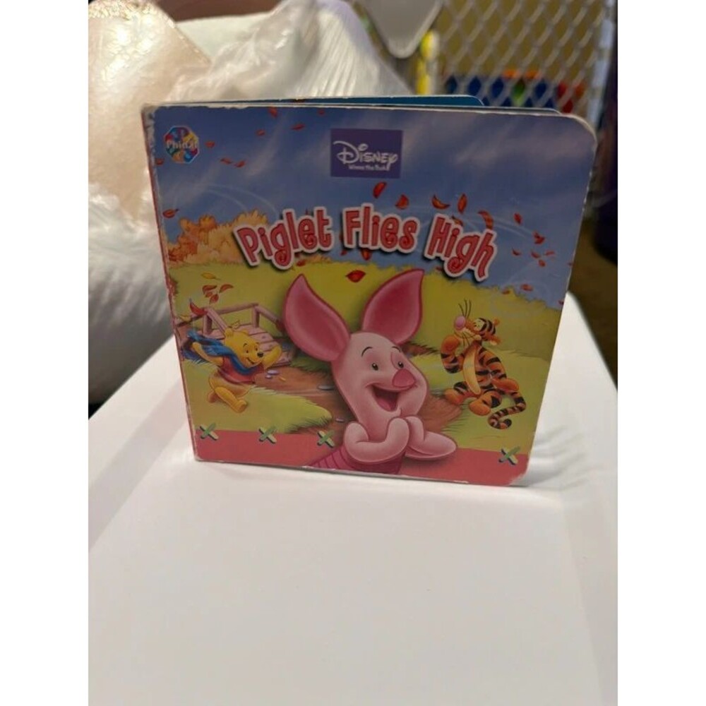Piglet flies high board book